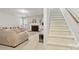 Inviting living room with a fireplace and staircase at 2308 Blair House Ct, Charlotte, NC 28270