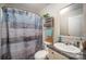 Bathroom featuring a shower with curtain, and a sink with storage and decorative elements at 251 Birch Tree Rd, Clover, SC 29710