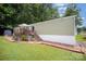 Charming single story home featuring a quaint front porch, manicured lawn and mature trees at 251 Birch Tree Rd, Clover, SC 29710