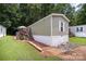 Charming single story home featuring a quaint front porch, manicured lawn and mature trees at 251 Birch Tree Rd, Clover, SC 29710