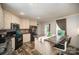 Eat-in kitchen featuring island with seating, black appliances, and great natural light at 251 Birch Tree Rd, Clover, SC 29710