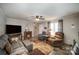 Comfortable living room featuring a fireplace, ceiling fan, and neutral decor at 251 Birch Tree Rd, Clover, SC 29710