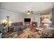 Inviting living room with cozy fireplace, plush seating, and wood-look flooring at 251 Birch Tree Rd, Clover, SC 29710