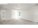 Light-filled bedroom with neutral carpet and tray ceiling, complemented by a window at 265 Miramar Dr, York, SC 29745