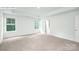 Bright bedroom with plush carpet and natural light showcasing a neutral color palette at 265 Miramar Dr, York, SC 29745