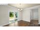 Bright dining room featuring hardwood floors, a modern chandelier, and sliding glass doors at 265 Miramar Dr, York, SC 29745
