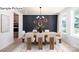 Elegant dining room featuring a long wood table, black accent wall, and backyard views at 265 Miramar Dr, York, SC 29745