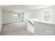 Upstairs bonus room featuring neutral carpet and two large windows for natural light at 265 Miramar Dr, York, SC 29745