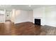 Spacious living room with hardwood floors, a fireplace, and an open layout at 265 Miramar Dr, York, SC 29745