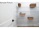 Walk-in pantry with ample shelving for organized storage, making grocery management a breeze at 265 Miramar Dr, York, SC 29745