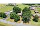 High aerial view of the property showing proximity to a road and surrounded by large mature trees at 3372 Lee Lawing Rd, Lincolnton, NC 28092
