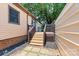 Charming back porch with a wooden deck, complemented by lush greenery and landscaping at 3372 Lee Lawing Rd, Lincolnton, NC 28092