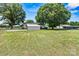 Spacious backyard with detached shed and additional structures, offering ample storage and utility at 3372 Lee Lawing Rd, Lincolnton, NC 28092