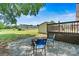 Cozy backyard with a fire pit area, chairs, and a wooden deck, perfect for entertaining at 3372 Lee Lawing Rd, Lincolnton, NC 28092