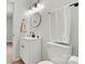 Bathroom with a white single sink vanity, round mirror, modern lighting, and white towel hanging on the wall at 3372 Lee Lawing Rd, Lincolnton, NC 28092