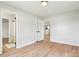 This bedroom features wood-look floors and a doorway leading to a bathroom and kitchen at 3372 Lee Lawing Rd, Lincolnton, NC 28092