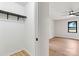 This closet includes a clothing rack and leads to a bedroom with wood-look floors and a window at 3372 Lee Lawing Rd, Lincolnton, NC 28092