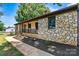 Charming home featuring stone and siding exterior with a welcoming front porch at 3372 Lee Lawing Rd, Lincolnton, NC 28092