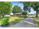 Beautiful home featuring stone accents, front porch, long driveway, and lush lawn at 3372 Lee Lawing Rd, Lincolnton, NC 28092
