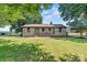 Charming stone and siding home with well-maintained lawn and inviting front porch at 3372 Lee Lawing Rd, Lincolnton, NC 28092