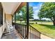 Inviting front porch with rocking chairs overlooking the manicured front lawn at 3372 Lee Lawing Rd, Lincolnton, NC 28092