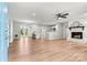 Open-concept living room featuring hardwood floors, fireplace, and ample natural light at 3372 Lee Lawing Rd, Lincolnton, NC 28092