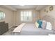 This bedroom has a queen size bed, side tables, wooden floors, shuttered windows, and wall decor at 4126 Tyndale Ave, Charlotte, NC 28210