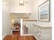 Inviting entryway with hardwood floors, decorative cabinet, and view into the light-filled living area at 4126 Tyndale Ave, Charlotte, NC 28210