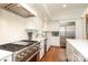 Modern kitchen featuring stainless steel appliances, granite countertops, and ample cabinet space at 4126 Tyndale Ave, Charlotte, NC 28210