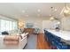 Open-concept layout connecting the kitchen, living, and dining area with hardwood floors and high ceilings at 4126 Tyndale Ave, Charlotte, NC 28210