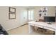 Bright office with a white desk, shuttered window, and wall decor at 4126 Tyndale Ave, Charlotte, NC 28210