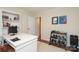 Office with a large desk, and a rack of dumbells at 4126 Tyndale Ave, Charlotte, NC 28210