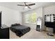 Bright bedroom with a ceiling fan, a large window, and modern decor at 4209 Grier St, Gastonia, NC 28056