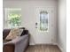 A welcoming entryway features a decorative glass door and a cozy living room setup at 4209 Grier St, Gastonia, NC 28056