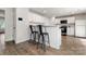 Modern kitchen boasts white cabinets, sleek countertops, and contemporary bar seating at 4209 Grier St, Gastonia, NC 28056