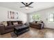 Bright living room with ample seating, modern ceiling fan, and natural light at 4209 Grier St, Gastonia, NC 28056