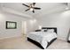 Neutral bedroom featuring a ceiling fan, carpet, and large window at 4209 Grier St, Gastonia, NC 28056