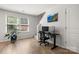 Bright office space with modern desk setup, large windows, and sleek hardwood floors at 4209 Grier St, Gastonia, NC 28056