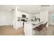 Modern kitchen boasts white cabinets, granite countertops, stainless appliances, and island seating at 432 Court House Ave, York, SC 29745