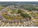 An aerial view showcasing a suburban neighborhood with well-manicured lawns and tree-lined streets at 4427 Poplin Grove Dr, Indian Trail, NC 28079