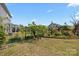 Backyard with a garden and fence that borders a landscaped backyard with garden features at 4427 Poplin Grove Dr, Indian Trail, NC 28079
