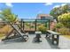 Backyard patio setup with seating and a lattice structure at 4427 Poplin Grove Dr, Indian Trail, NC 28079