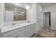 Bathroom with double sink vanity with framed mirror and walk-in shower at 4427 Poplin Grove Dr, Indian Trail, NC 28079