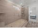 Luxurious shower features pebble floor, wall shower heads, and glass surround at 4427 Poplin Grove Dr, Indian Trail, NC 28079
