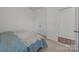 Bedroom features neutral carpet and bed; bright natural light at 4427 Poplin Grove Dr, Indian Trail, NC 28079