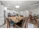 Open concept dining area adjacent to a modern kitchen and a cozy living space at 4427 Poplin Grove Dr, Indian Trail, NC 28079