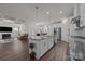 Bright kitchen featuring a large island with granite countertops and stainless steel appliances at 4427 Poplin Grove Dr, Indian Trail, NC 28079