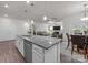Open kitchen with granite countertops, stainless steel appliances, and seamless view of the living area at 4427 Poplin Grove Dr, Indian Trail, NC 28079