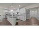 Kitchen with granite island, stainless appliances, and white cabinets at 4427 Poplin Grove Dr, Indian Trail, NC 28079