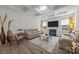 Inviting living room featuring a fireplace, coffered ceiling and hardwood flooring at 4427 Poplin Grove Dr, Indian Trail, NC 28079